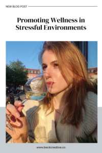 Promoting Wellness in Stressful Environments - Emily sipping a glass of wine in Germany.